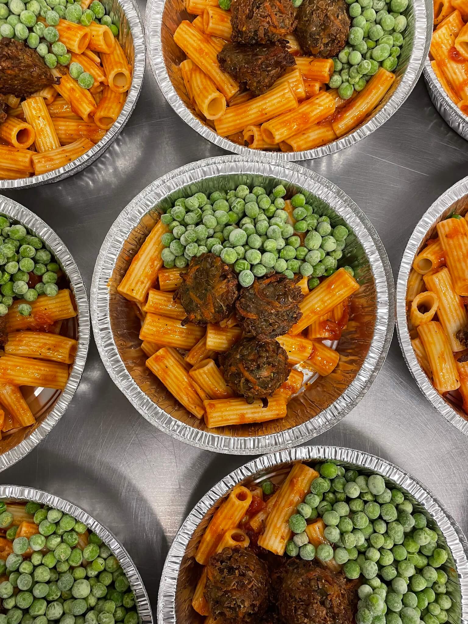 Zucchini balls, peas, carrots and pasta with marinara sauce Stock Pot