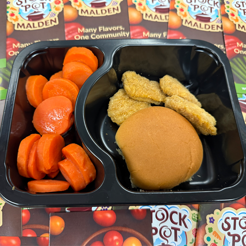 School Meal Prepared with carrots, bun and chicken nuggets